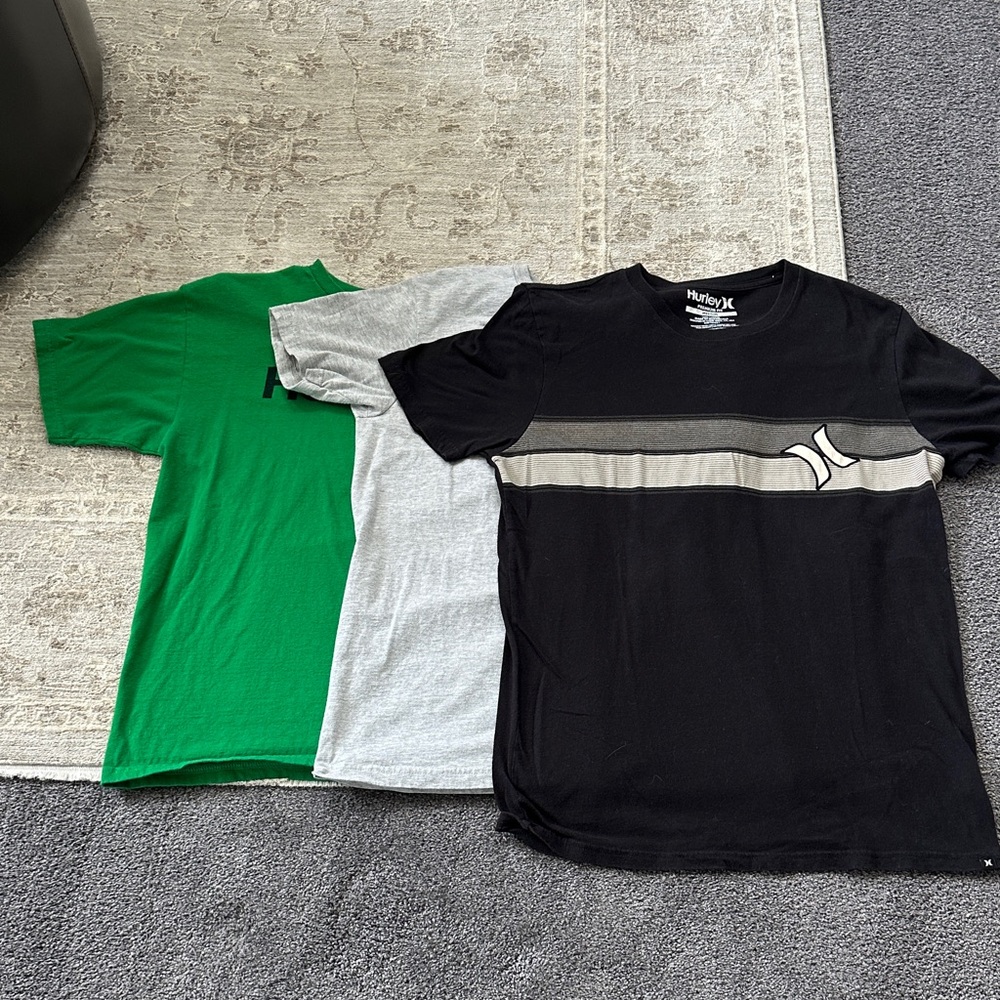 Hurley Bundle of three Men's Medium Black, Gray, and Green T-Shirts.